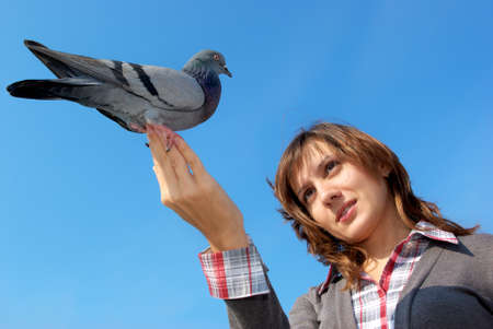 Girl and dove on hand. Element of design.の写真素材