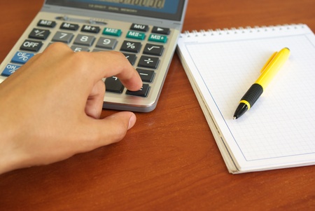 Hand and calculator. Element of design.の写真素材