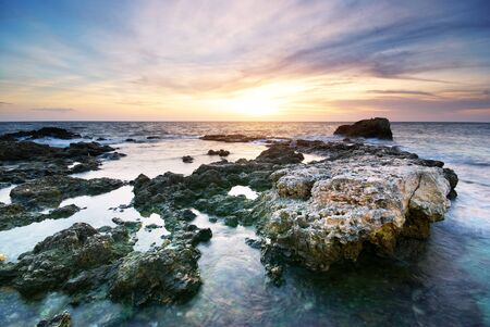 Beautiful seascape. Sea and rock at the sunset. Nature composition.の写真素材