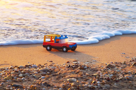 Toy on sea shore. Nature conceptual compositon.の写真素材