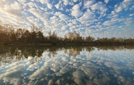 Morning water reflection on river. Nature composition.の写真素材
