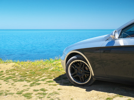 Car on the sea shore. Travel design.の写真素材