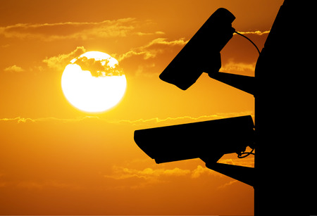 Silhouette of security cctv camera on sky backgrond. Element of design.