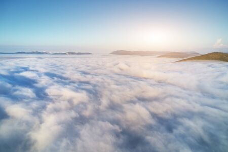 Aerial view white clouds in blue sky at morning. Top cloudscape view from drone.
