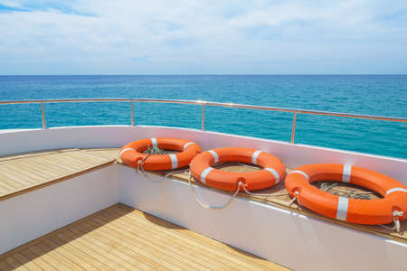 Lifebuoy on the yacht deck. Recreation on sea travel.