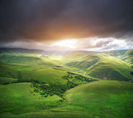 Green mountain hills during the sunset. Nature landscape.