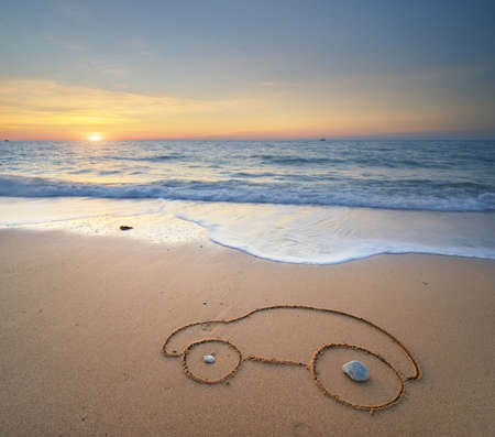 Car drawing on sea shore during the sunset. Nature and concept design.の写真素材