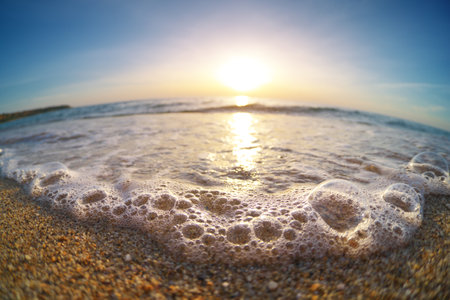 Sea foam on the beach of seashore. Nature landscape scene.の写真素材