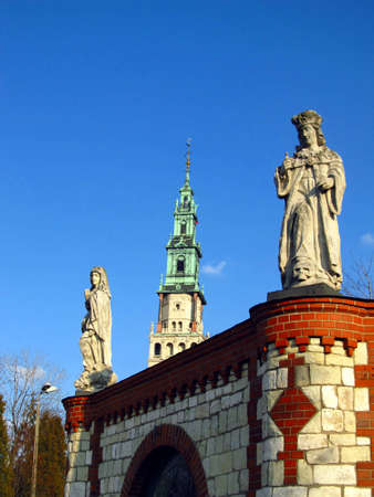 Czestochowa Jasna Gora, the view of the tower of the monastery and figures of saints on the wall around the monasteryのeditorial素材