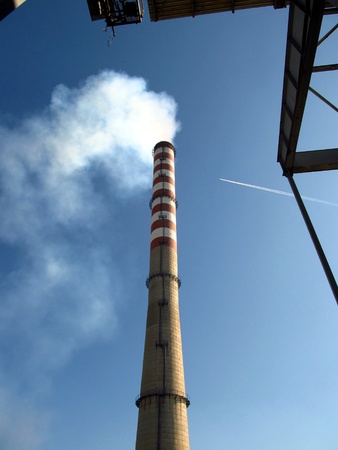 tall chimney and the upper part of a large power boilerの写真素材