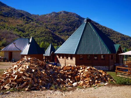 buildings in the mountain Durmitor in Montenegro with firewood for the winterのeditorial素材
