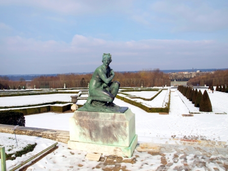 statue in the park of Versailles near Paris in France in winter, the snow in the parkのeditorial素材