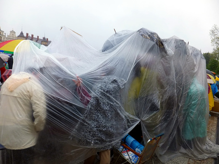 community under one protective film - XIX National Sleep Renewal of the Holy Spirit in the pouring rain before the peak of Jasna Gora in Czestochowa, Poland, 17 may 2014のeditorial素材