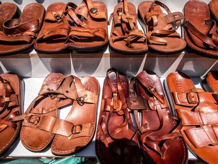 sandals made of camel skin, called Jesus sandals exposed for sale in a shop on the road to the Holy Land, Israelの写真素材