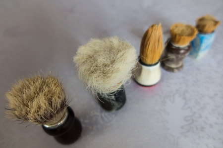 new and old shaving brush in varying degrees of wearの写真素材