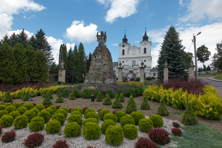 Dukla, Poland - July 22, 2016: Old statue of Mary in front of the Shrine of St. John of Dukla in Dukla, Poland. Bernardine Monasteryのeditorial素材