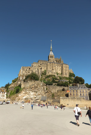 Mont Saint Michel, France - September 8, 2016: Panoramic view of famous Le Mont Saint-Michel tidal island on a sunny day with blue sky and clouds, Normandy, northern Franceのeditorial素材