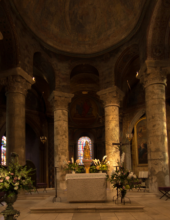 Poitiers, France - September 12, 2016: Very old church Notre Dame la Grande in Poitiers, France, in the interior in place of the chief figure of the Virgin Mary with Jesus and the keys to the cityのeditorial素材