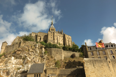 Panoramic view of famous Le Mont Saint-Michel tidal island on a sunny day with blue sky and clouds, Normandy, northern Franceのeditorial素材