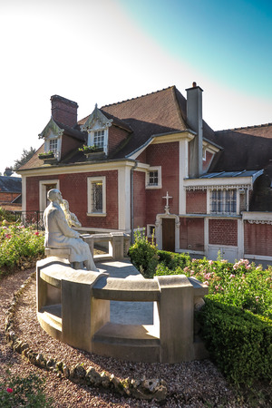 House in Lisieux, where she lived St. Therese of the Child Jesus before joining Carmel. The garden statue of St. Teresa and St. Louis Martin her father.のeditorial素材