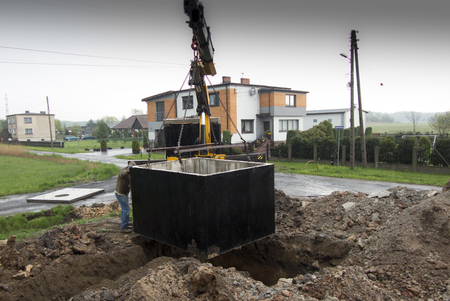 insert concrete septic septic tank to earlier dug downの写真素材