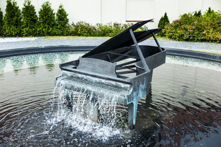Fountain in the shape of a piano in the village of Koszecin in southern Polandの写真素材