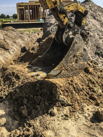 Excavation of water connections on the construction of a detached houseの写真素材