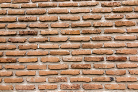 brick wall with a large layer of mortar as a backgroundの写真素材