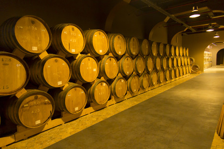YEREVAN, ARMENIA, 21 SEPTEMBER 2017: Wooden barrels of aged wine at the Brandy Factory of Noy...