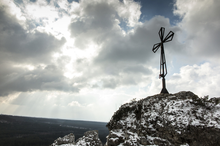 A hill called Maly Giewont with a characteristic cross in Olsztyn near Czestochowa in Silesia in Polandの写真素材