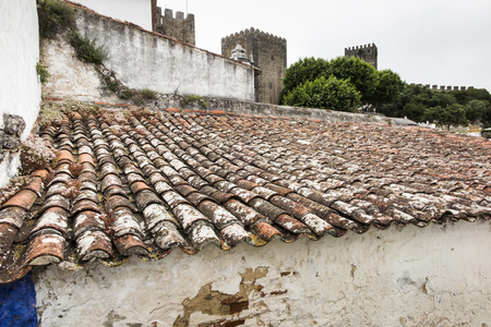 Characteristic red tiles in the old, medieval, Portuguese town of Obidos as backgrund,の写真素材