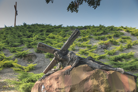 Chelm, Poland, 10 September 2018: Calvary around the Basilica of the Blessed Virgin Mary in Chelm, sculpture by Jacek Kicinski - station 9, Jesus falls for the third time. Shrine of Our Lady in Chelm in eastern Polandの写真素材