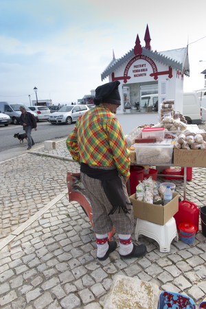 Nazare, Portugal, June 13, 2018: Sales of regional products on the square in the seaside tourist town of Nazare in Portugal.のeditorial素材