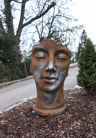 Bolkow, Poland, 6 December 2018: Monument of the face next to the pavement near the entrance to the castle of Bolkow in Lower Silesia in Polandのeditorial素材