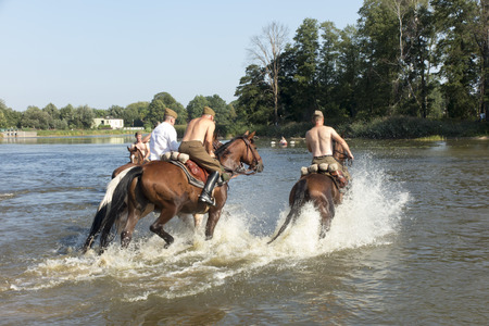 Kalety, Zielona, Poland August 31, 2019: Horse Rally along the Battle Trail of the 3rd Silesian Uhlans Regiment, swimming the horses of the Volunteer Squadron in the Zielona, Polandのeditorial素材