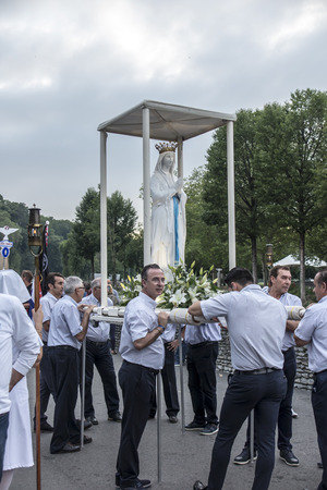 Lourdes, France June 24, 2019: Preparation for going out to the evening rosary procession at the Marian shrine in Lourdes, France.のeditorial素材