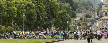 Lourdes, France June 24, 2019: Volunteers helping the sick get to the sanctuary of Our Lady in Lourdes, famous for many healings.のeditorial素材