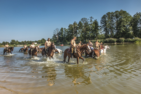 Kalety, Zielona, Poland August 31, 2019: Horse Rally along the Battle Trail of the 3rd Silesian Uhlans Regiment, swimming the horses of the Volunteer Squadron in the Zielona, Polandのeditorial素材