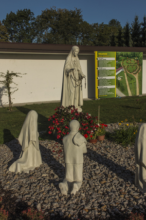 Chelm, Poland, September 14, 2019: Shrine, the Basilica of the Virgin Mary in Chelm in eastern Poland near Lublin. Rosarium or rosary garden with statues of the Mother of God and childrenのeditorial素材