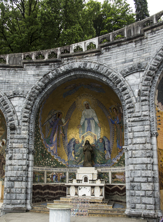 Lourdes, France, 24 June 2019: Mosaic of the studio of Marko Rupnik on the wall in front of the entrance to the Rosary Basilica in Lourdes.のeditorial素材