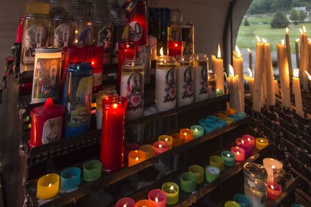 lit candles at the Marian shrine in Lourdes, Franceの写真素材