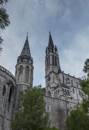 View of the basilica buildings above the Massabielle grotto at the Marian Shrine in Lourdes, Franceのeditorial素材