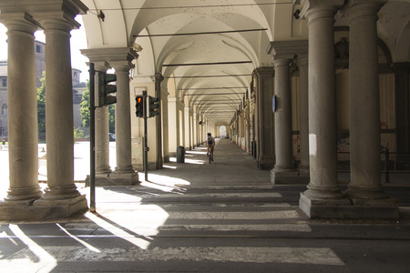 Turin, Piedmont, Italy. June 27, 2019: The famous arcades of the city: reference for walking observing the windows of the many clothing and accessory shops or enjoying a good bar.のeditorial素材