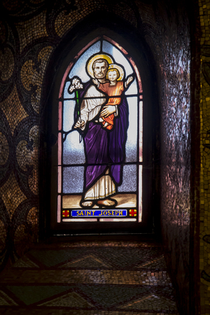 Lourdes, France, 24 June 2019: Stained glass window in the Basilica of the Immaculate Conception in Lourdes, France - Saint Josephのeditorial素材