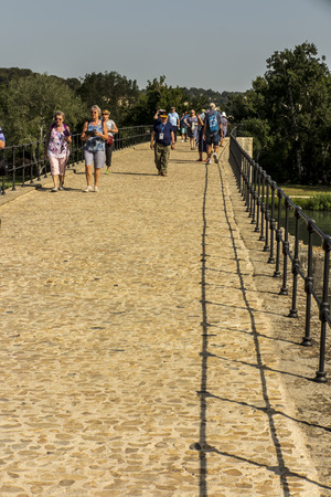 Avignon, France June 26, 2019: Tourists on the famous Saint Benadict Bridge (st. BÃ©nÃ©zet bridge) in Avignon, known as the Avignon bridge.のeditorial素材