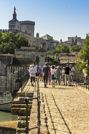 Avignon, France June 26, 2019: Tourists on the famous Saint Benadict Bridge (st. BÃ©nÃ©zet bridge) in Avignon, known as the Avignon bridge.のeditorial素材