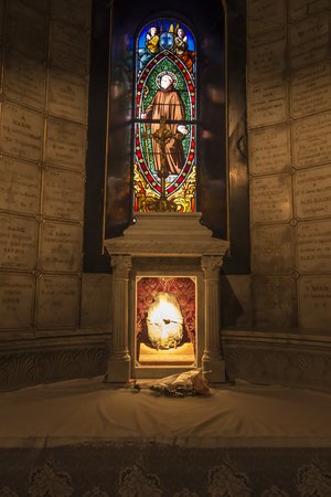 La Salette, France, June 26, 2019: A fragment of a stone bench on which the Mother of God sat at the beginning of her revelation in La Salette, France, on September 19, 1846.のeditorial素材