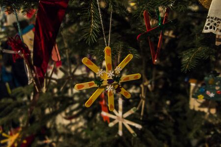 Christmas decorations made of waste - properly arranged and painted ice cream sticksの写真素材