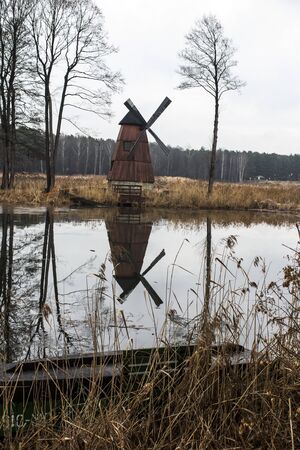 old windmill on the island of the pond on the Mala Panew river in Kalety Zielona in Poland, winter...