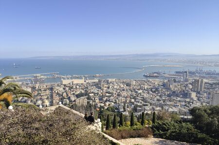 View of Haifa from the hill. Partly visible gardens of the Bahai (Shrine of the Bab), a holy pilgrimage for the Bahai believers built on Mount Carmel in Haifa, Israel.の写真素材